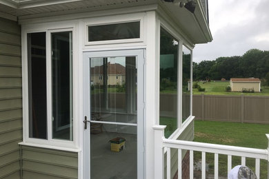 Example of a mid-sized classic home design design in Other