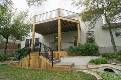 Mid-sized trendy backyard deck photo in Austin with no cover