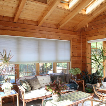 11ft Vaulted ceiling in custom built sunroom with 4 skylights, in log cabin.