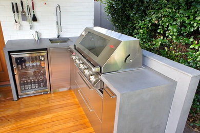 Outdoor Kitchens with Polished Concrete Benchtops & Stainless Steel Doors