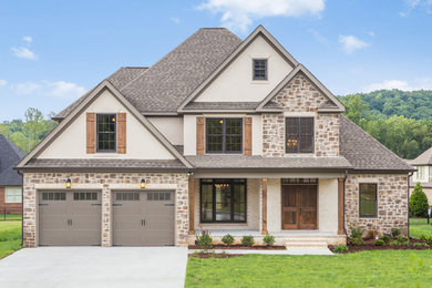 Example of a mid-sized classic multicolored three-story mixed siding gable roof design in Other