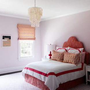 Photo of a transitional bedroom in Charlotte with pink walls.