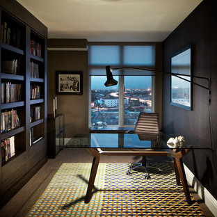 Inspiration for a medium sized modern study in Denver with brown walls, dark hardwood flooring, no fireplace and a freestanding desk.