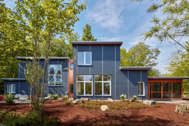 Example of a large mountain style blue two-story concrete fiberboard and clapboard exterior home design in Manchester