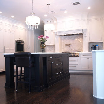 Pendant Chandeliers and Dark Wood Island