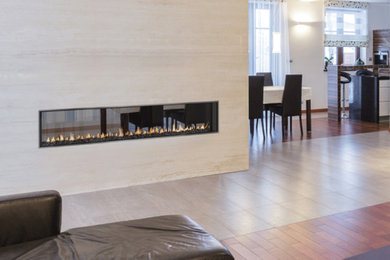 Inspiration for a mid-sized contemporary formal and open concept porcelain tile and beige floor living room remodel in Denver with white walls, a ribbon fireplace and a stone fireplace