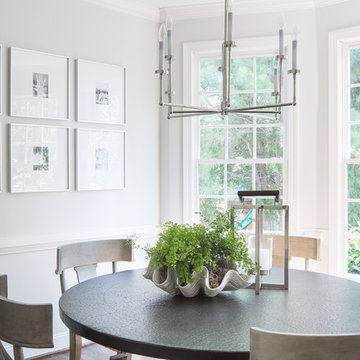 Light-Filled Dining Room with Round Table, Modern Chandelier & Gallery Wall