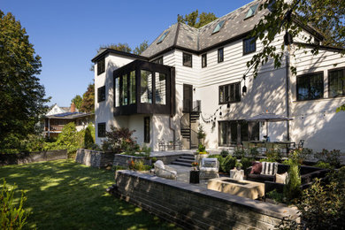 Large transitional white four-story concrete fiberboard house exterior photo in Boston with a hip roof, a shingle roof and a gray roof
