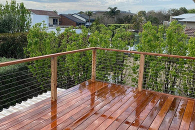 Design ideas for a beach style deck in Melbourne.