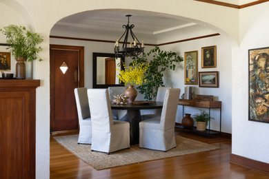 Inspiration for a mediterranean medium tone wood floor dining room remodel in Orange County with yellow walls