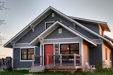 Inspiration for a mid-sized transitional gray two-story wood exterior home remodel in Other with a shingle roof