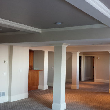 Elegant Basement Transformation with Custom Painted Ceilings and Built-Ins