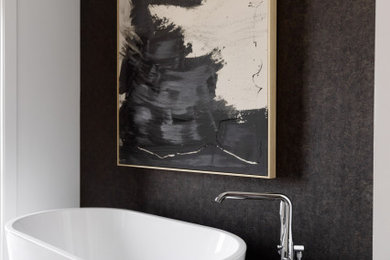 Example of a large transitional master black tile porcelain tile, gray floor, double-sink and wallpaper freestanding bathtub design in Phoenix with a two-piece toilet