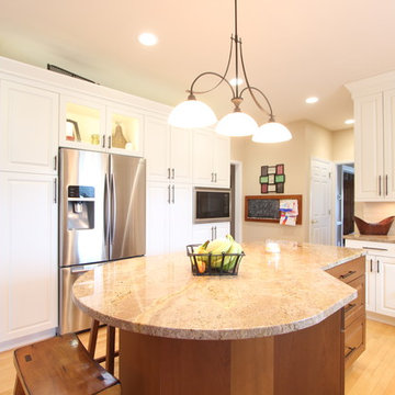 Glass Cabinet Above Refrigerator Offers Additional Display Space