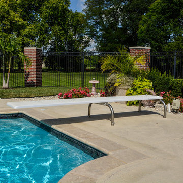 Grecian swimming pool with L, diving board and hot tub