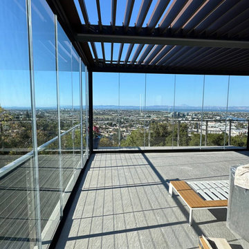 Frameless Sliding Glass Walls for a Panoramic Veranda in California