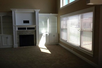 Inspiration for a transitional carpeted living room remodel in Other with beige walls, a standard fireplace, a tile fireplace and a media wall