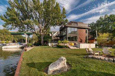 Small minimalist gray two-story wood exterior home photo in Cleveland