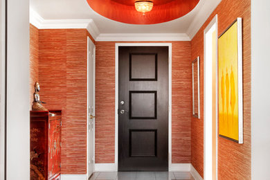 Expansive asian front door in Toronto with red walls, light hardwood floors, a single front door and a dark wood front door.