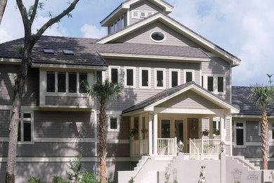 Example of a huge trendy gray three-story wood exterior home design in Charlotte