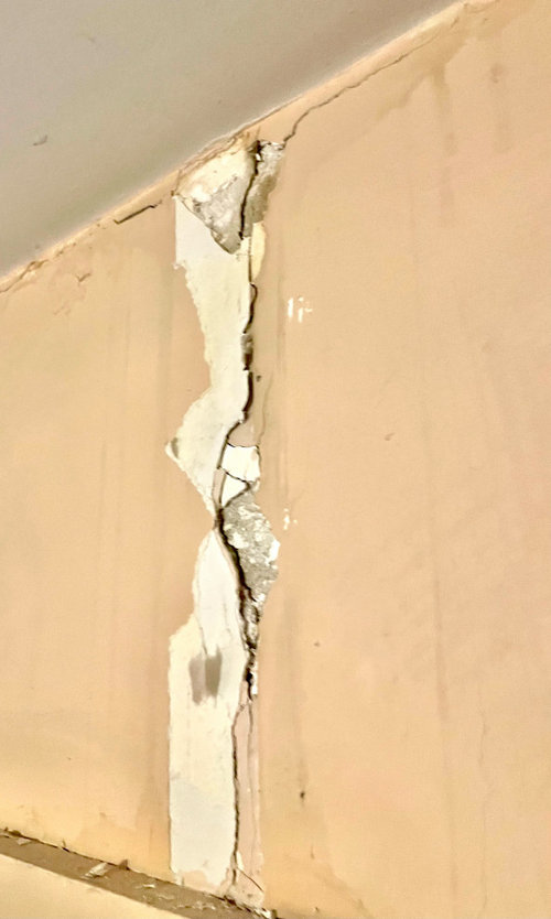 Repairing old plaster walls- removing painted paper (not wallpaper)?