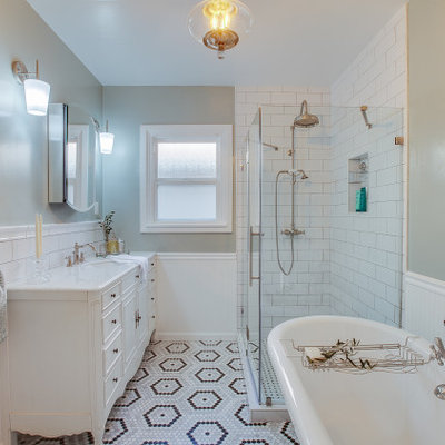 Inspiration for a small timeless master green tile marble floor, multicolored floor, single-sink and wainscoting bathroom remodel in Los Angeles with furniture-like cabinets, white cabinets, a one-piece toilet, green walls, a drop-in sink, marble countertops, a hinged shower door, white countertops and a freestanding vanity