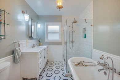Inspiration for a small timeless master green tile marble floor, multicolored floor, single-sink and wainscoting bathroom remodel in Los Angeles with furniture-like cabinets, white cabinets, a one-piece toilet, green walls, a drop-in sink, marble countertops, a hinged shower door, white countertops and a freestanding vanity