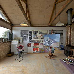 Photo of a country home studio in Adelaide with white walls and a wood stove.