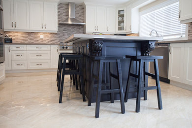 Eat-in kitchen - mid-sized modern u-shaped eat-in kitchen idea in Toronto