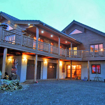 Cedar half log siding, cedar posts and railing, D trim and knotty pine paneling