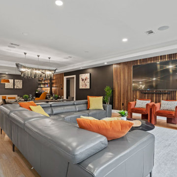 Warm contemporary living room with charcoal sofa and saffron accents