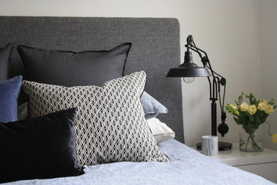 Design ideas for a mid-sized modern master bedroom in Melbourne with white walls, carpet, no fireplace and grey floor.