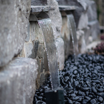 Luxury Backyard Retreat with Armour Stone & Water Feature | Genesis on the Lakes
