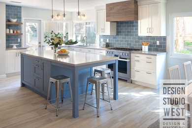 Eat-in kitchen - large traditional l-shaped vinyl floor and multicolored floor eat-in kitchen idea in San Diego with a single-bowl sink, shaker cabinets, white cabinets, quartzite countertops, blue backsplash, glass tile backsplash, stainless steel appliances, an island and gray countertops