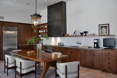 Inspiration for a mid-sized modern l-shaped terra-cotta tile and beige floor open concept kitchen remodel in Los Angeles with an undermount sink, flat-panel cabinets, dark wood cabinets, quartz countertops, white backsplash, ceramic backsplash, stainless steel appliances and an island