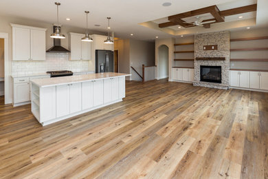 Living room - large country open concept vinyl floor and brown floor living room idea in Other with a standard fireplace and a stone fireplace
