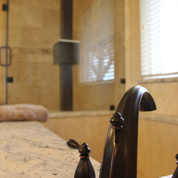 Undermount Marble Tub with Bianco Romano Granite and Frameless Shower