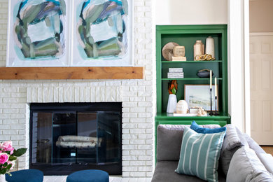 Example of a family room design in San Francisco with a brick fireplace