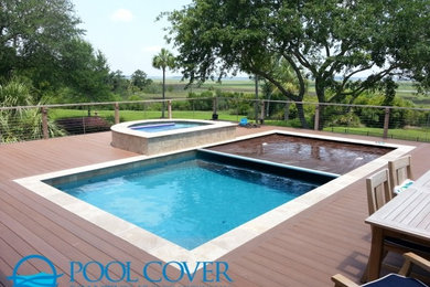 Large elegant backyard rectangular natural pool fountain photo in Charleston with decking