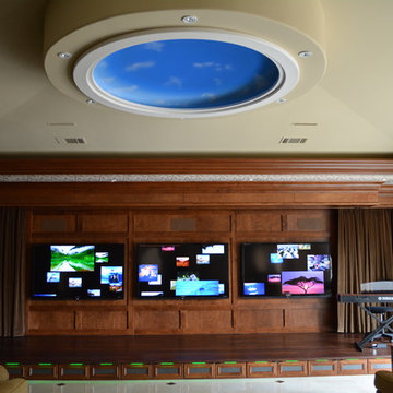 Hidden speakers from Definitive Technology. Control by RTI.