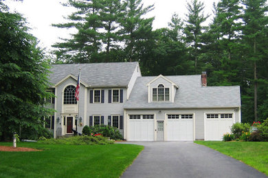Blue two-story vinyl exterior home idea in Boston