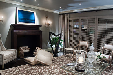 Inspiration for a small contemporary enclosed dark wood floor and black floor family room remodel in DC Metro with a music area, gray walls, a standard fireplace, a wood fireplace surround and a concealed tv
