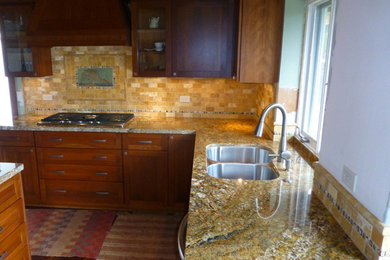 Enclosed kitchen - mid-sized contemporary l-shaped dark wood floor enclosed kitchen idea in San Diego with a double-bowl sink, shaker cabinets, dark wood cabinets, granite countertops, beige backsplash, stone tile backsplash, stainless steel appliances and an island