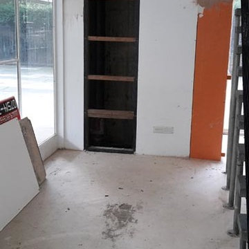Installing Wall Cladding and Concrete Floor Tiles in Hide Tower