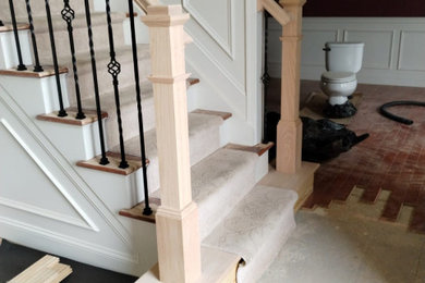 Example of a mid-sized classic carpeted l-shaped mixed material railing staircase design in Orlando with carpeted risers