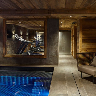 リヨンの中サイズのラスティックスタイルのおしゃれなトレーニングルーム (グレーの壁、セラミックタイルの床) の写真