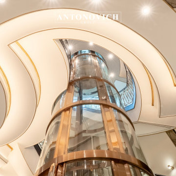 Statement Vertical Design | Circular Elevator & Staircase by Antonovich Group