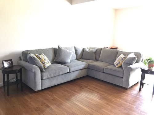 I need help choosing area rug to go under this sofa in living room.