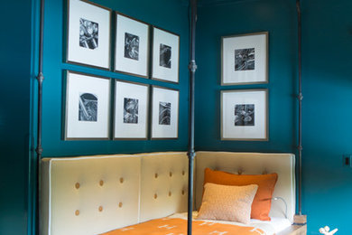 Bedroom - mid-sized industrial guest dark wood floor and brown floor bedroom idea in Orange County with blue walls and no fireplace