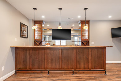 Example of a trendy light wood floor basement design in DC Metro